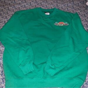 “friends” medium green pullover from cotton on